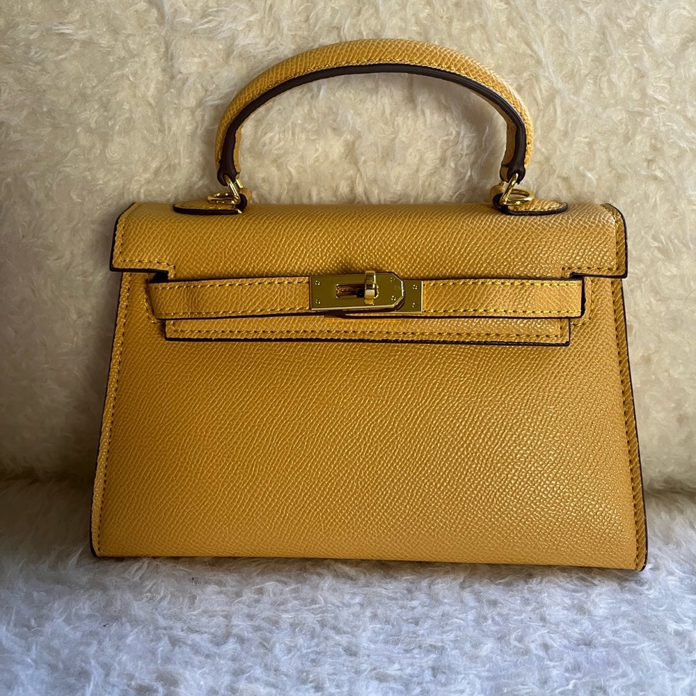 Classic mini handbag with removable & adjustable crossbody strap.